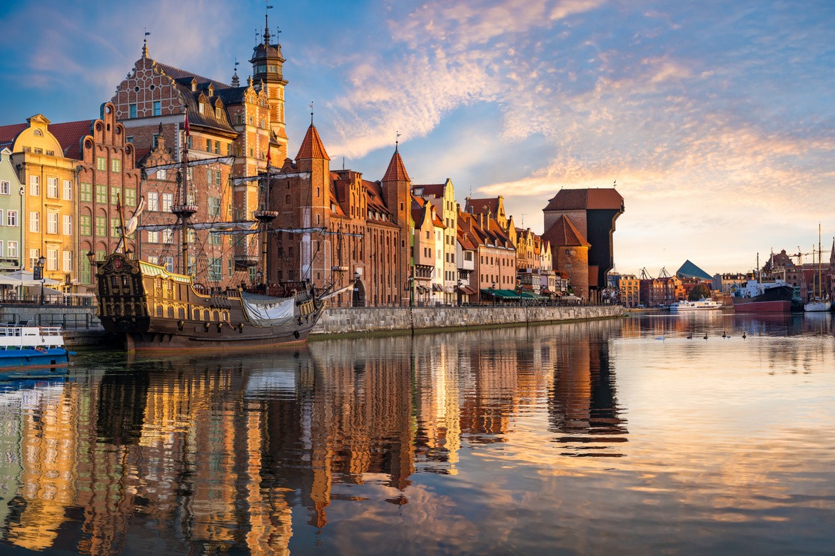 Poland, Gdansk, Famous Neptune fountain at sunset. Popular tourist attraction and travel destination in Europe